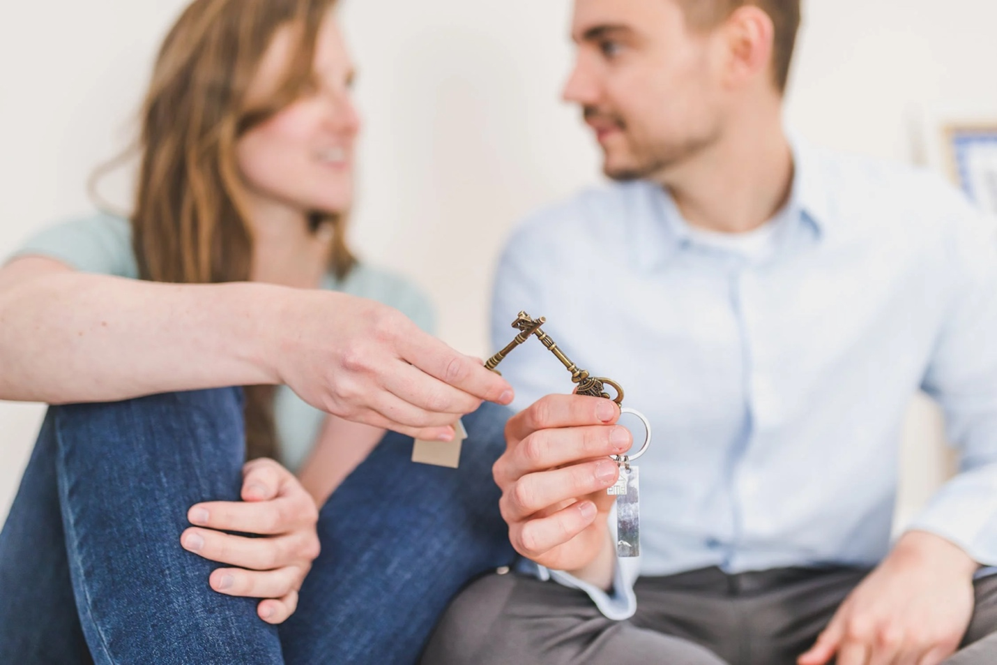 Couple holding keys to new house